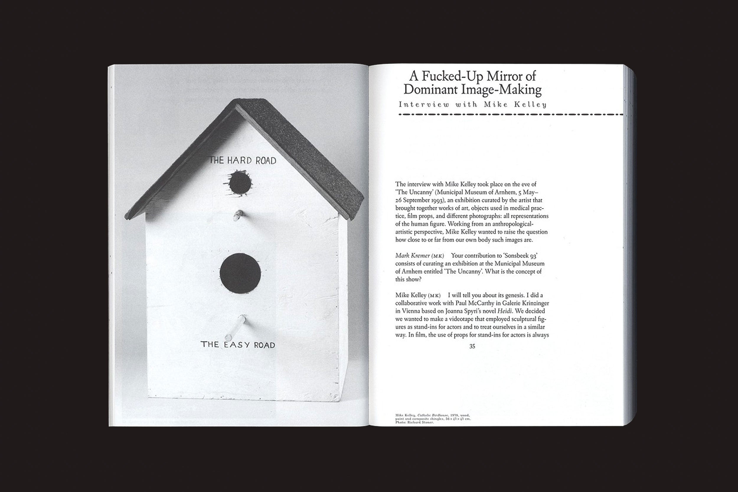Uma parte do livro de Valiz *Beautiful Madness - Art Writing as Art Curating: Mark Kremer* mostra uma foto de casa de passarinho chamada THE HARD ROAD/THE EASY ROAD e uma entrevista, "A Fucked-Up Mirror of Dominant Image-Making", sobre curadoria de arte.