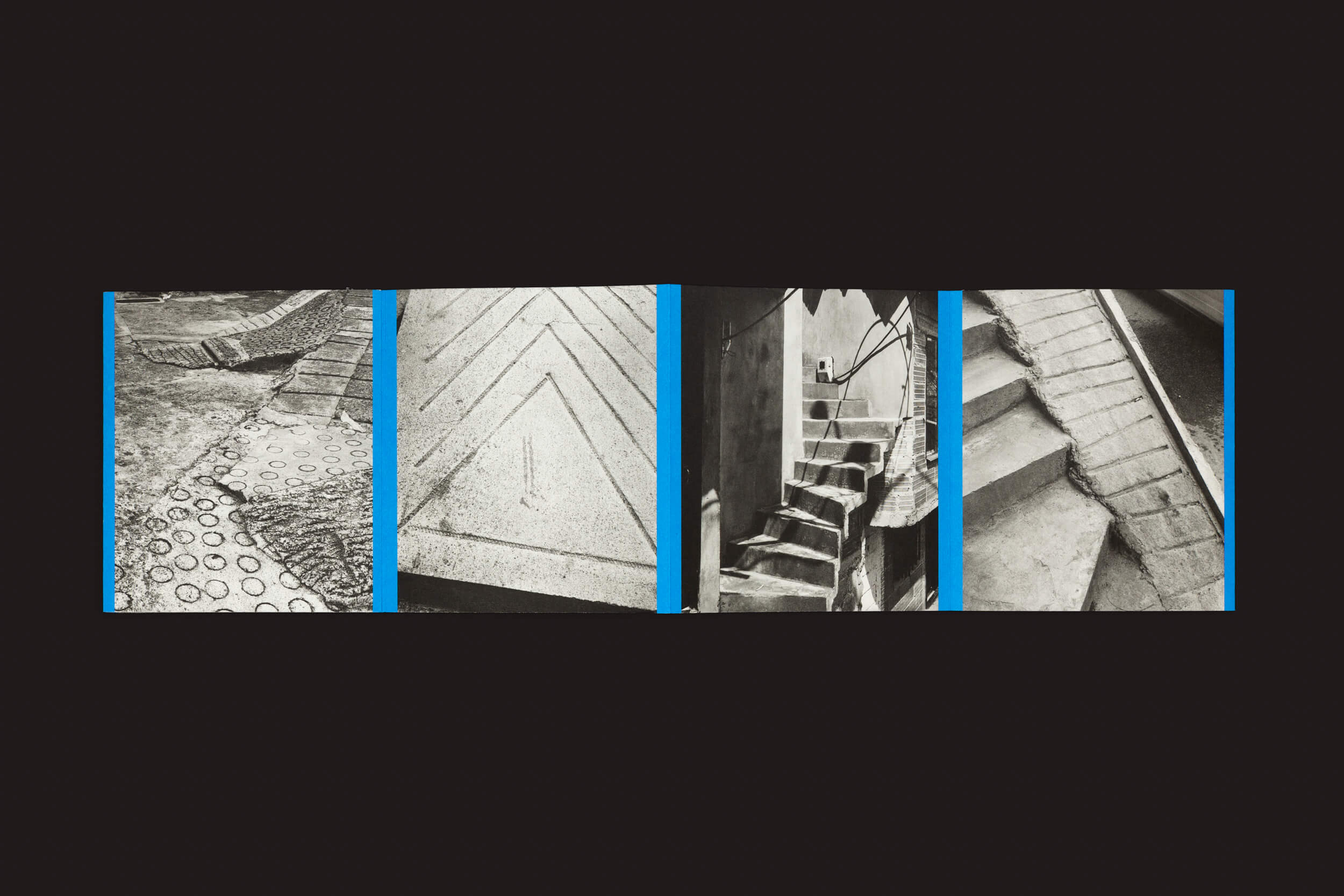 Thomas Locke Hobbs: Rampitas, da The Eriskay Connection, apresenta uma colagem de cinco fotos de texturas arquitetônicas em preto e branco sobre um fundo preto, cada uma delimitada por uma linha azul, exibindo padrões de pedra, linhas diagonais de concreto, escadas e rampas esculturais do brutalismo popular.