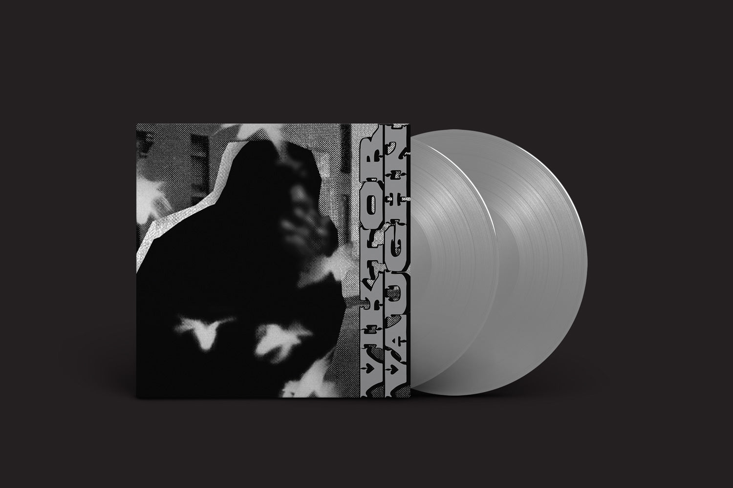 Um conjunto de discos de vinil com uma capa abstrata em preto e branco com Viktor Vaughn em fonte vertical em negrito. Inclui dois discos cinza translúcidos, que lembram a vibe Vaudeville Villain do MF DOOM. Nome do produto: Viktor Vaughn: Vaudeville Villain da Rhymesayers Entertainment.