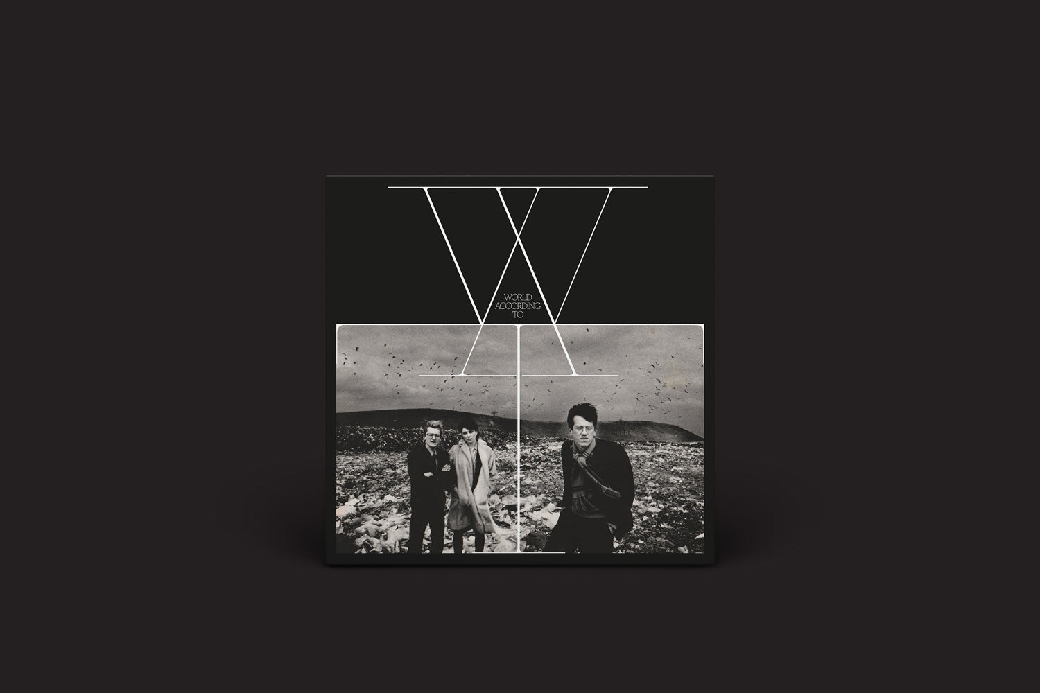 O álbum W.A.T: World According To (Eindhoven 1983-1985) de Stroom apresenta uma capa preta com um X branco no topo, "World Tokyo" abaixo e uma foto central em preto e branco refletindo o estilo punk original do Defreeze.