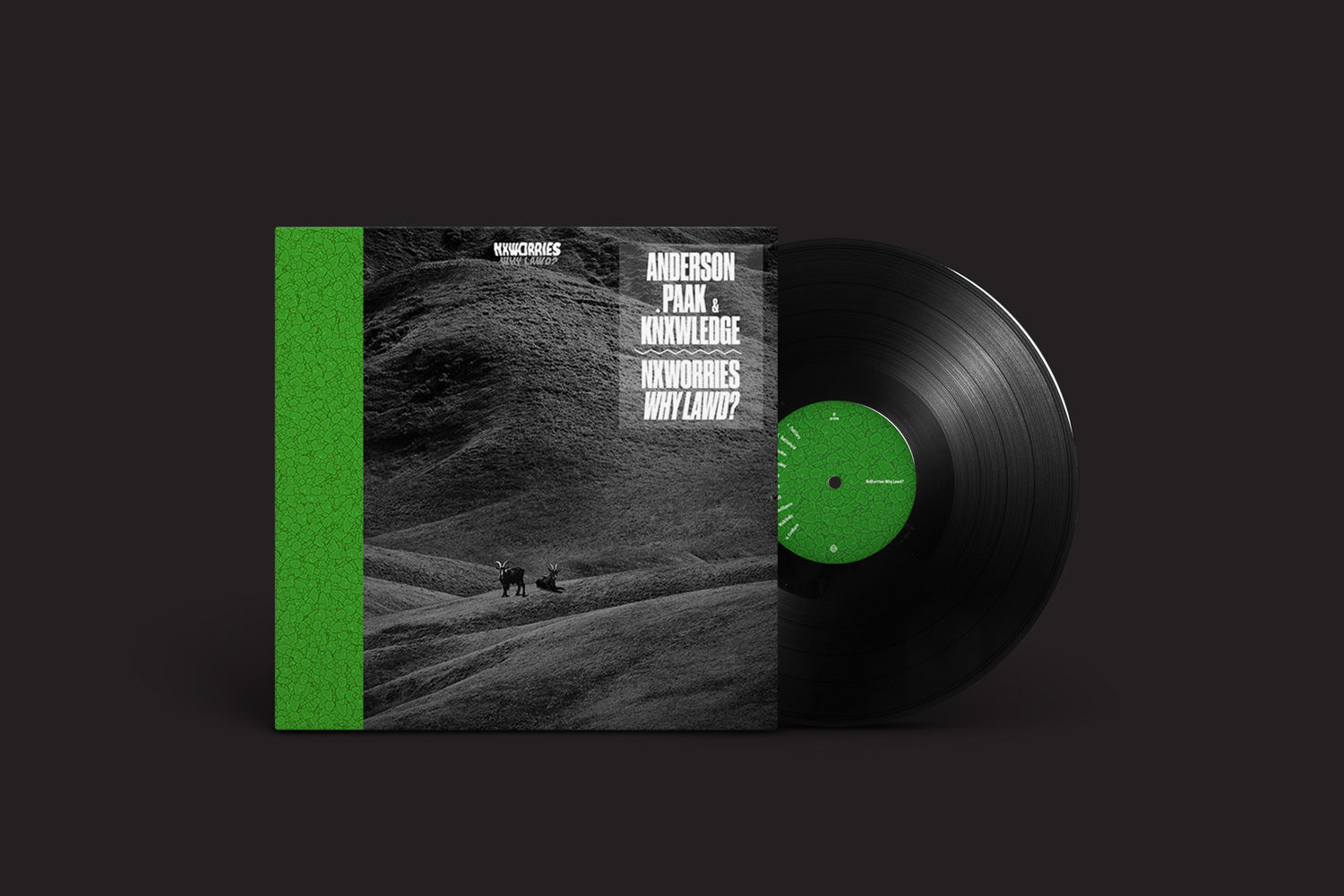 A capa do álbum NxWorries: Why Lawd? da Stones Throw Records mostra um disco de vinil com uma imagem em preto e branco de duas figuras caminhando em uma paisagem montanhosa. Uma faixa verde exibe NxWorries - Anderson Paak x Knowledge - Yes Lawd!.